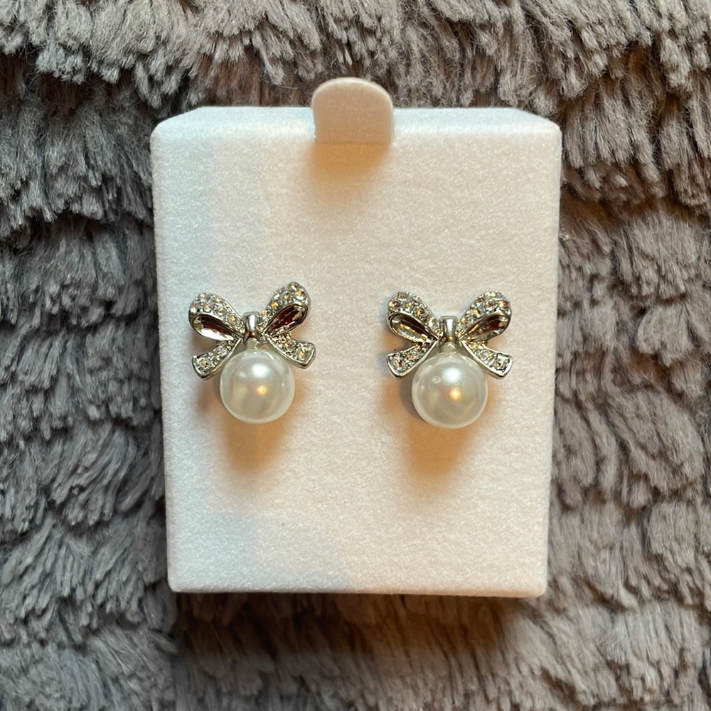 Pearl and silver bow earrings